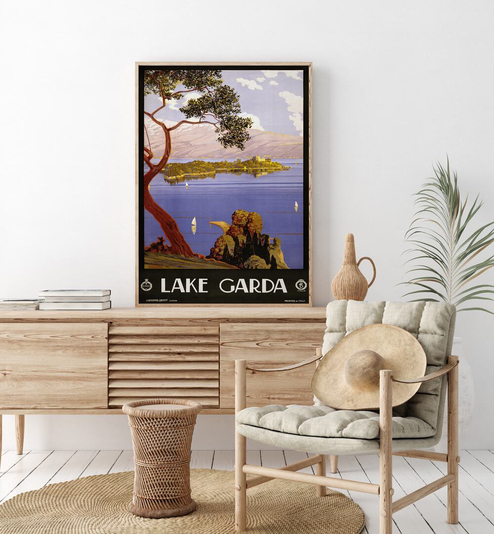 Lake Garda Retro Vintage Travel Vintage Travel Posters in Oak Wood Plain Frame on  a console table beside a plant