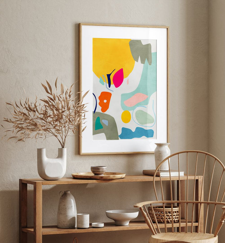 Landscape Inspired Cut Out By Ana Rut Bre Abstract Art Abstract Wall Art in Oak Wood Frame With Mount placed on a wall behind a table