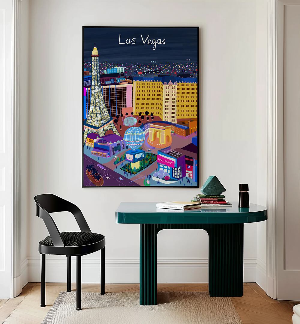 Las Vegas Night View by Carla Daly Travel Posters in Black Plain Frame placed on a wall behind a study table