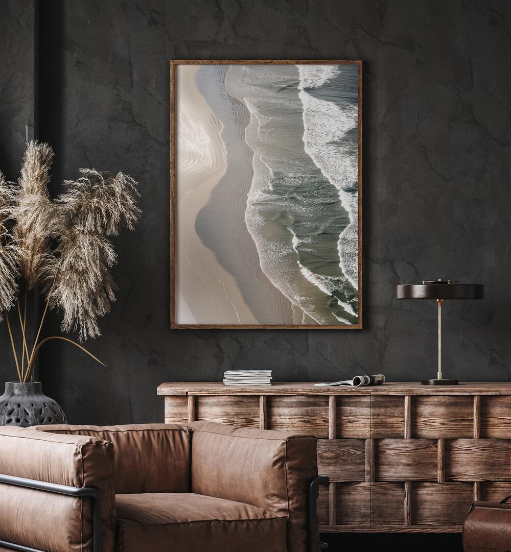 Layered Horizons Beach Prints Coastal Wall Art in Oak Wood Plain Frame placed on a wall behind a table