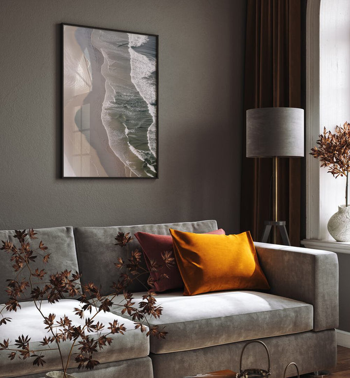 Layered Horizons Beach Prints Coastal Wall Art in Black Plain Frame placed on a wall behind a sofa
