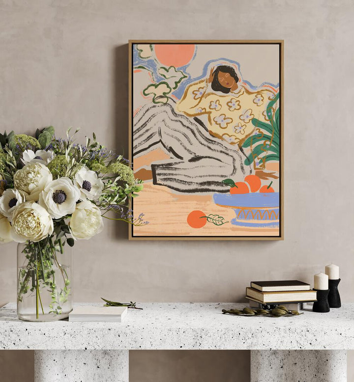 Lazy Days By Arty Guava Wall Art Prints in Oak Wood Floater Frame placed on a Beige Colored Wall above a Console Table in the Drawing Room