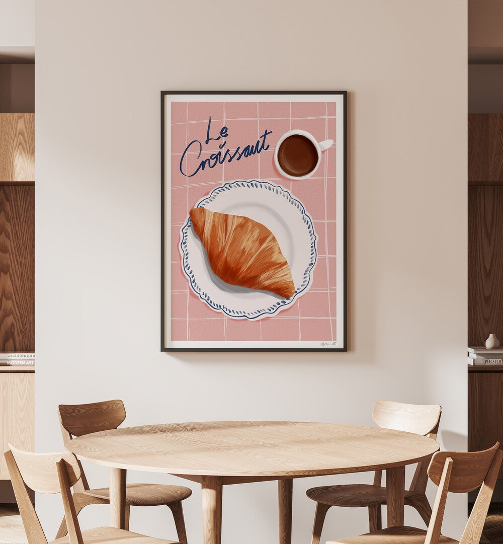 Le Croissant Cafe Art Prints Cafe Posters in Black Plain Frame placed on a Cream Colored Wall near a Dining Table in the Dining Room