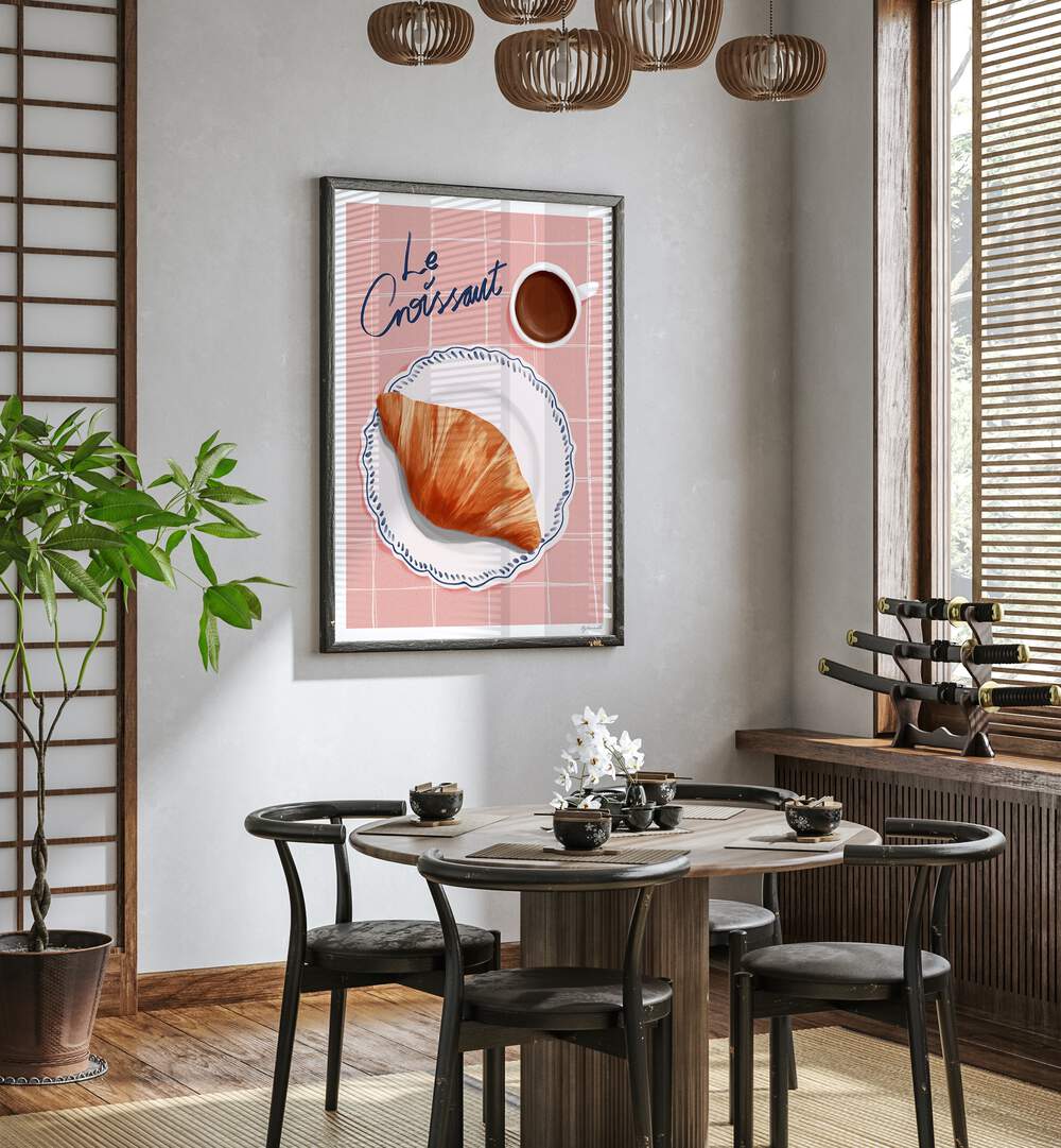 Le Croissant Cafe Art Prints Cafe Posters in Dark Wood Plain Frame placed on a White Colored Wall near a Coffee Table in the Dining Room