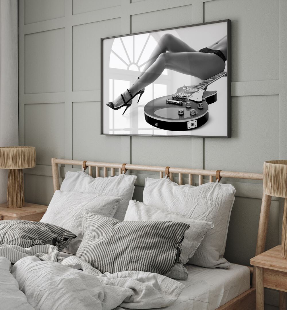 Leggy Les Paul by David Drake Fine Art Photography Fashion Photography in Black Plain Frame placed on a bedroom wall behind a bed 