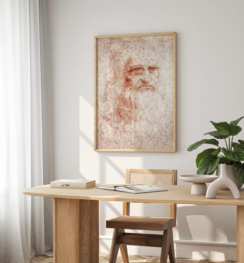 Leonardo Da Vinci Self Portrait 1512 Vintage Paintings in Oak Wood Plain Frame placed on a white wall behind a study table