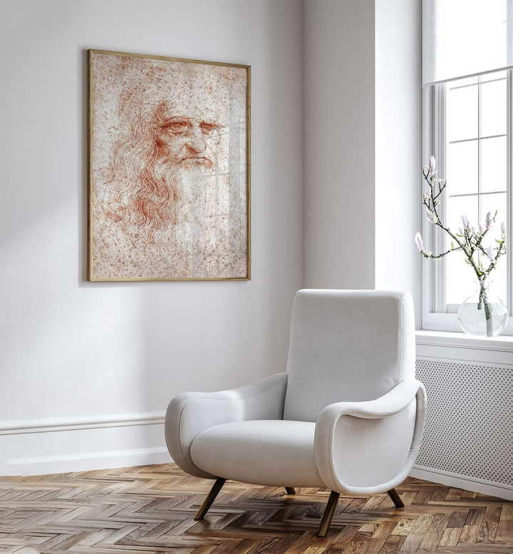 Leonardo Da Vinci Self Portrait 1512 Vintage Paintings in Oak Wood Plain Frame placed on a white wall beside a white chair and a window