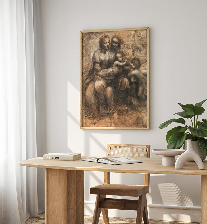 Leonardo Da Vincis The Leonardo Cartoon 1499–1500 Vintage Paintings in Oak Wood Plain Frame placed on a white wall behind a study table