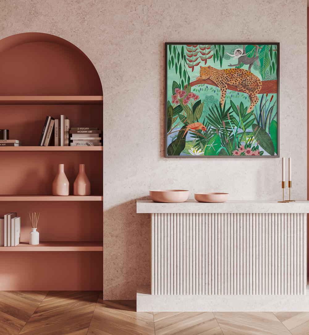 Leopard in the Jungle By Caroline Bonne Muller Wildlife Paintings in Black Plain Frame on a pink wall above a table