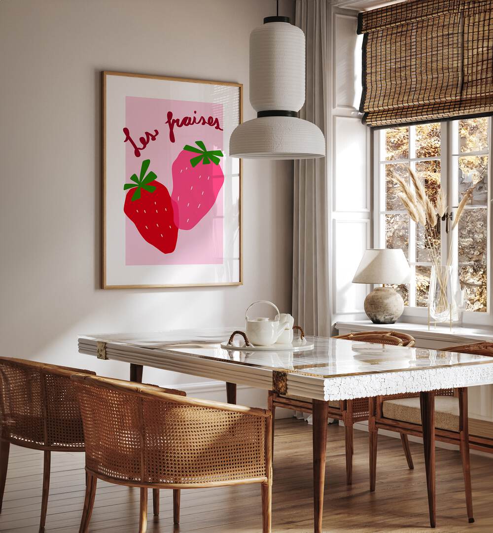 Les Fraises by Athene Fritsch Kitchen Posters Kitchen Art Prints in Oak Wood Plain Frame placed on a wall in a dining room area beside a window and behind a dining table