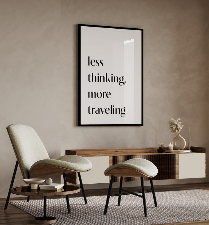 Less Thinking By 1 X Studio Quotes And Typography Posters in Black Plain Frame placed on a Beige Colored Wall above a Console Table in the Drawing Room