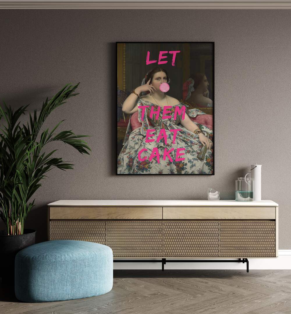 Let Them Eat Cake by the Art Concept Altered Art Prints in Black Plain Frame placed on a wall behind a console table