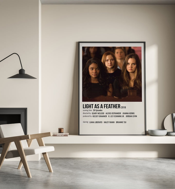 Light As Feather 2018 Movie Posters in Black Plain Frame place on a wall behind a chair beside lamp