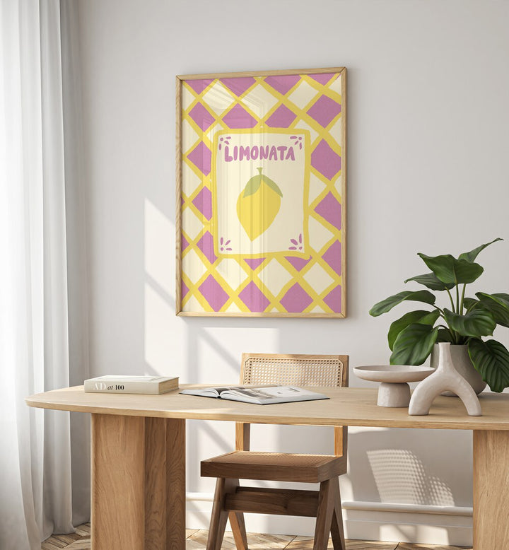 Limonata by Studio Dolci Kitchen Art Prints in Oak Wood Plain Frame on a wall behind a study table