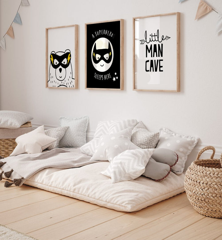 Little Man Cave Set Of 3 Paintings in Oak Wood Plain Frame placed on a wall behind a bed in kids room