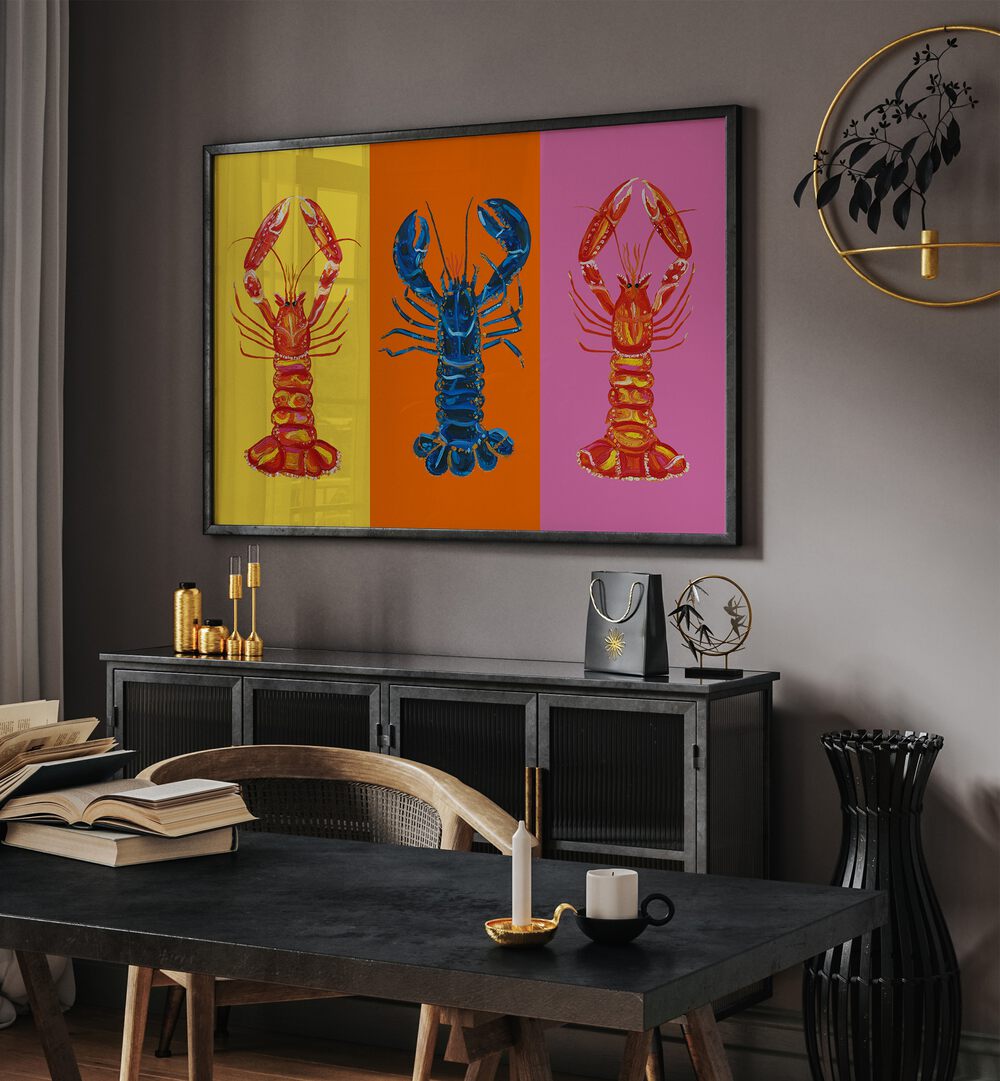 Lobster Langoustines iii by Alice Straker Pop Art Paintings Pop Art Prints in Black Plain Frame placed on a wall behind a console table