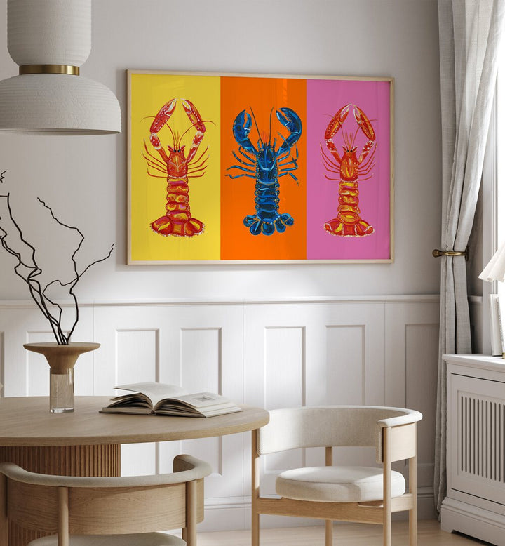 Lobster Langoustines iii by Alice Straker Pop Art Paintings Pop Art Prints in Oak Wood Plain Frame placed on a wall in a dining room area beside a window and behind a dining table 