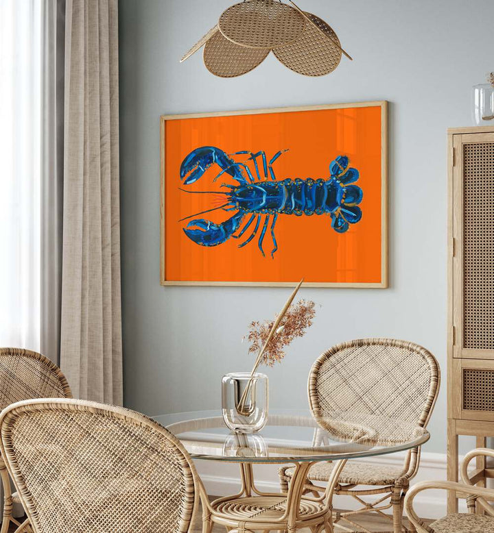 Lobster on Orange by Alice Straker Cafe Art Prints Cafe Posters in Oak Wood Plain Frame placed on a wall in a dining room area beside a window and behind a dining table