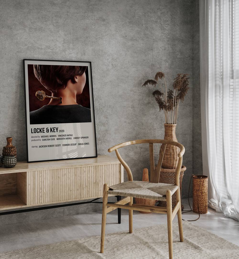 Locke Key 2020 Ii Movie Posters in Black Plain Frame placed on a table beside oakwood chair