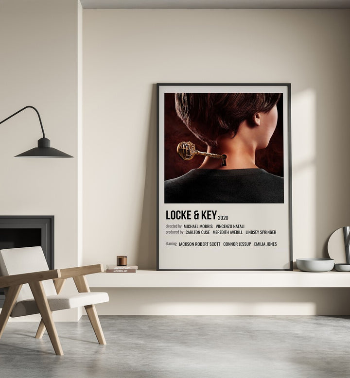 Locke Key 2020 Ii Movie Posters in Black Plain Frame place on a wall behind a chair beside lamp