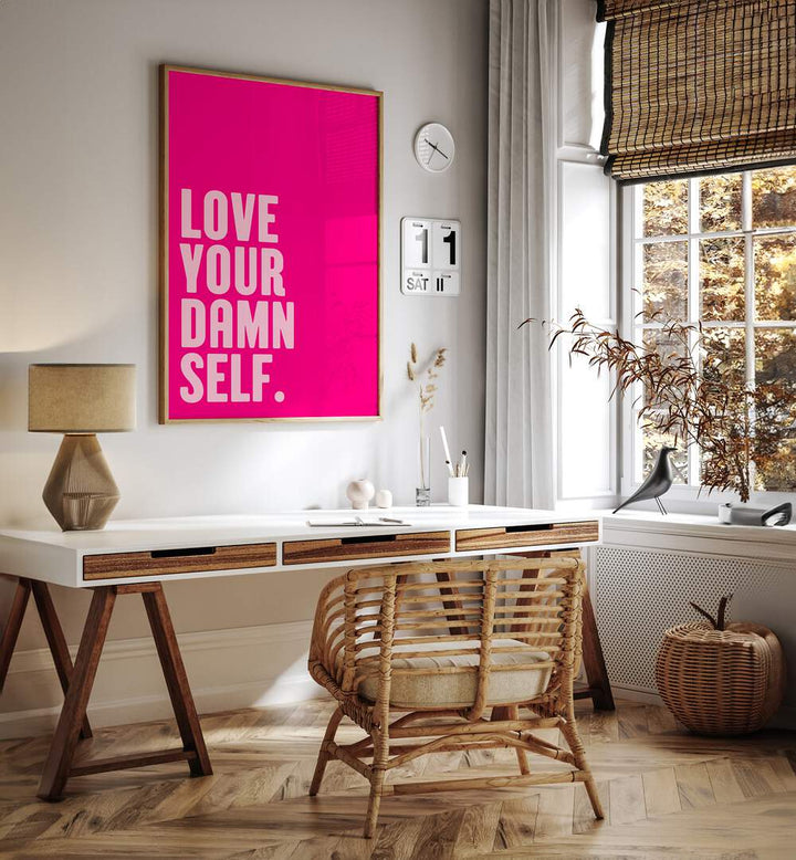 Love Your Damn Self by Athene Fritsch Quotes and Typography Posters in Oak Wood Plain Frame placed on a wall behind a study table and beside window