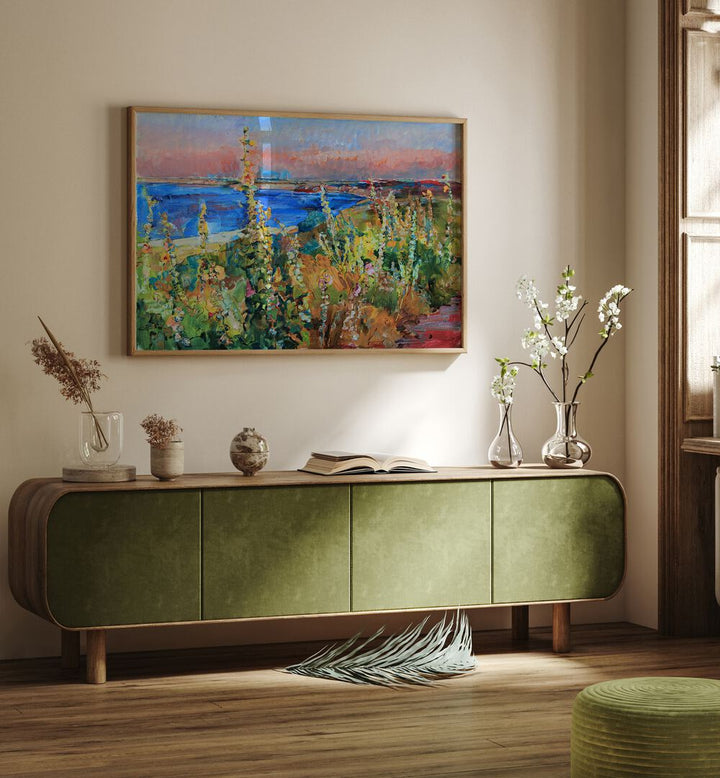 Colorful landscape painting titled "MALLOWS BY THE SEA," brightening a cozy interior space with a beachside vibe.