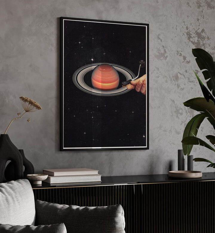 Meteor Mashup II Surreal Art Painting Artwork in black frame with mount above a console table beside a plant