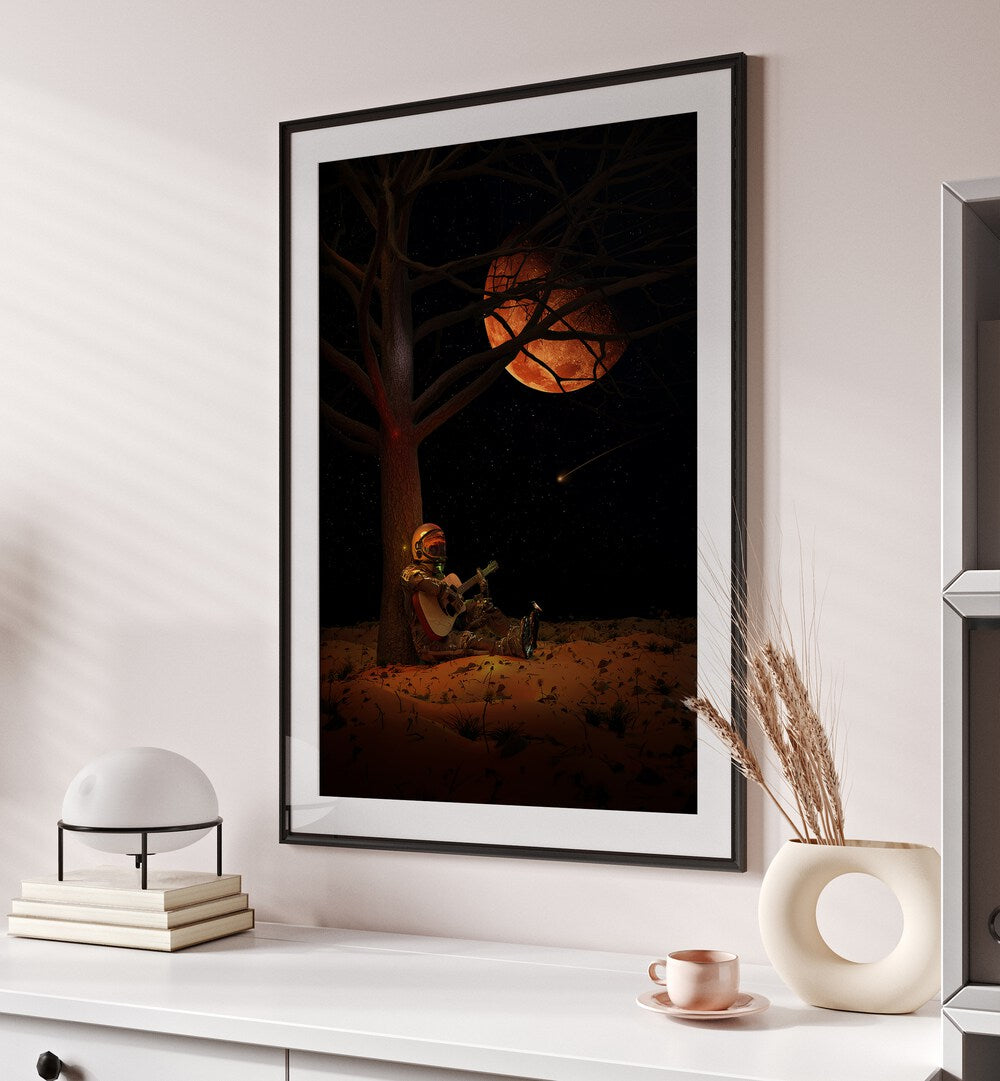 Moonlight Jam By Francis Minoza Astronaut & Nasa Paintings, Space Art Prints Artwork in Black Frame With Mount placed on a Cream Colored Wall above a Console Table
