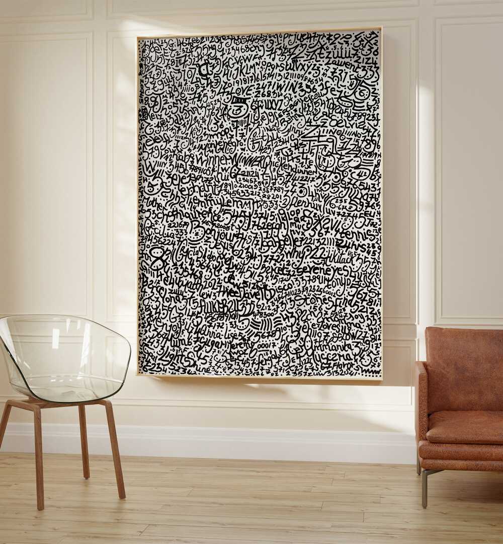 Mopi Doodle Art Painting Artwork in plain oakwood frame on white wall beside a sofa