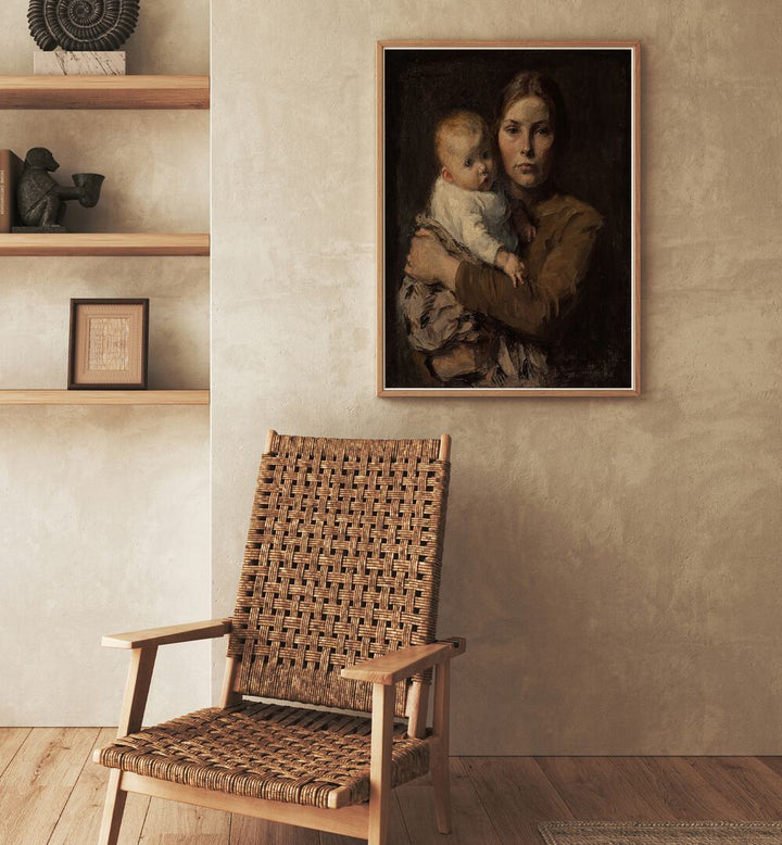 Mother And Child - Gari Melchers Vintage Art Painting Artwork in plain oakwood frame behind a chair on a beige colour wall