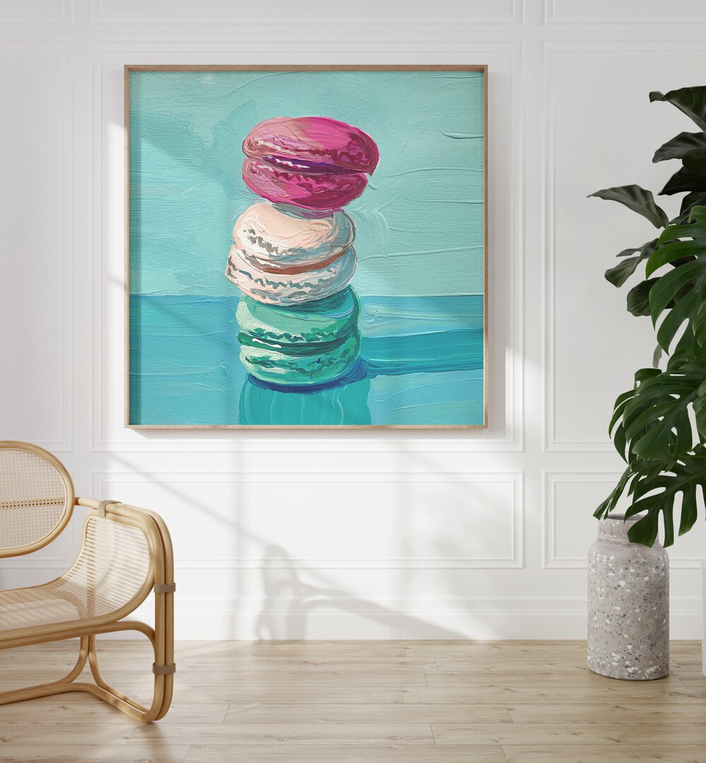 Macarons By Key And Sea Creative Bar and Cafe Artwork in Oak Wood Plain Frame on a white wall beside a plant