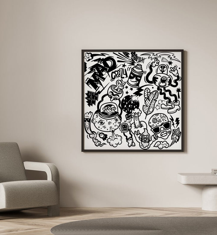 Madness Unboxed Doodle Art Painting in Black Plain Frame placed on the wall beside the chair