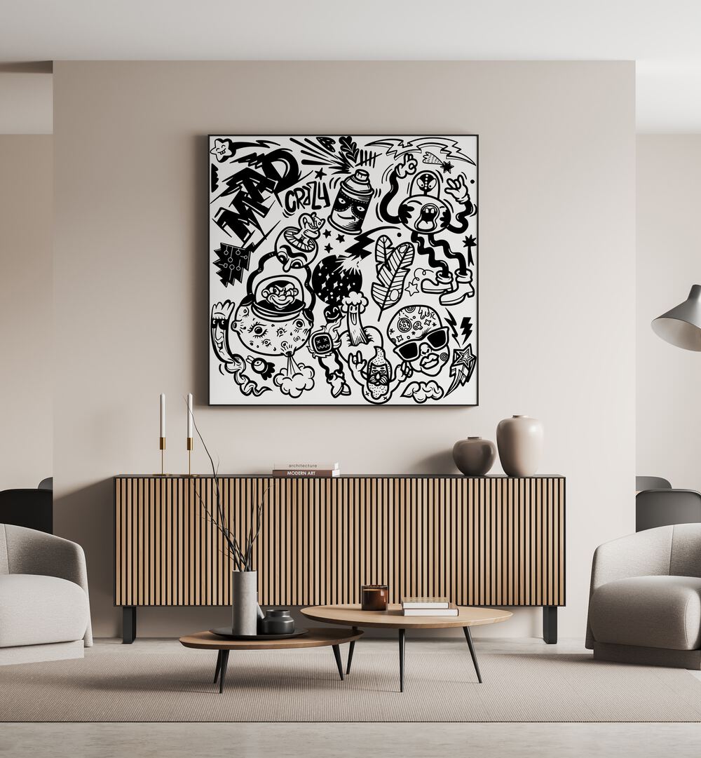 Madness Unboxed Doodle Art Painting in Black Plain Frame placed on wall behind a wooden table