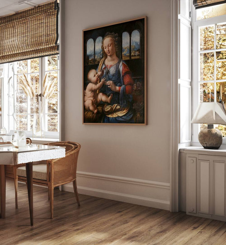 Madonna Of The Carnation 1470s Vintage Paintings in Oak Wood Plain Frame placed on a wall between windows behind a table