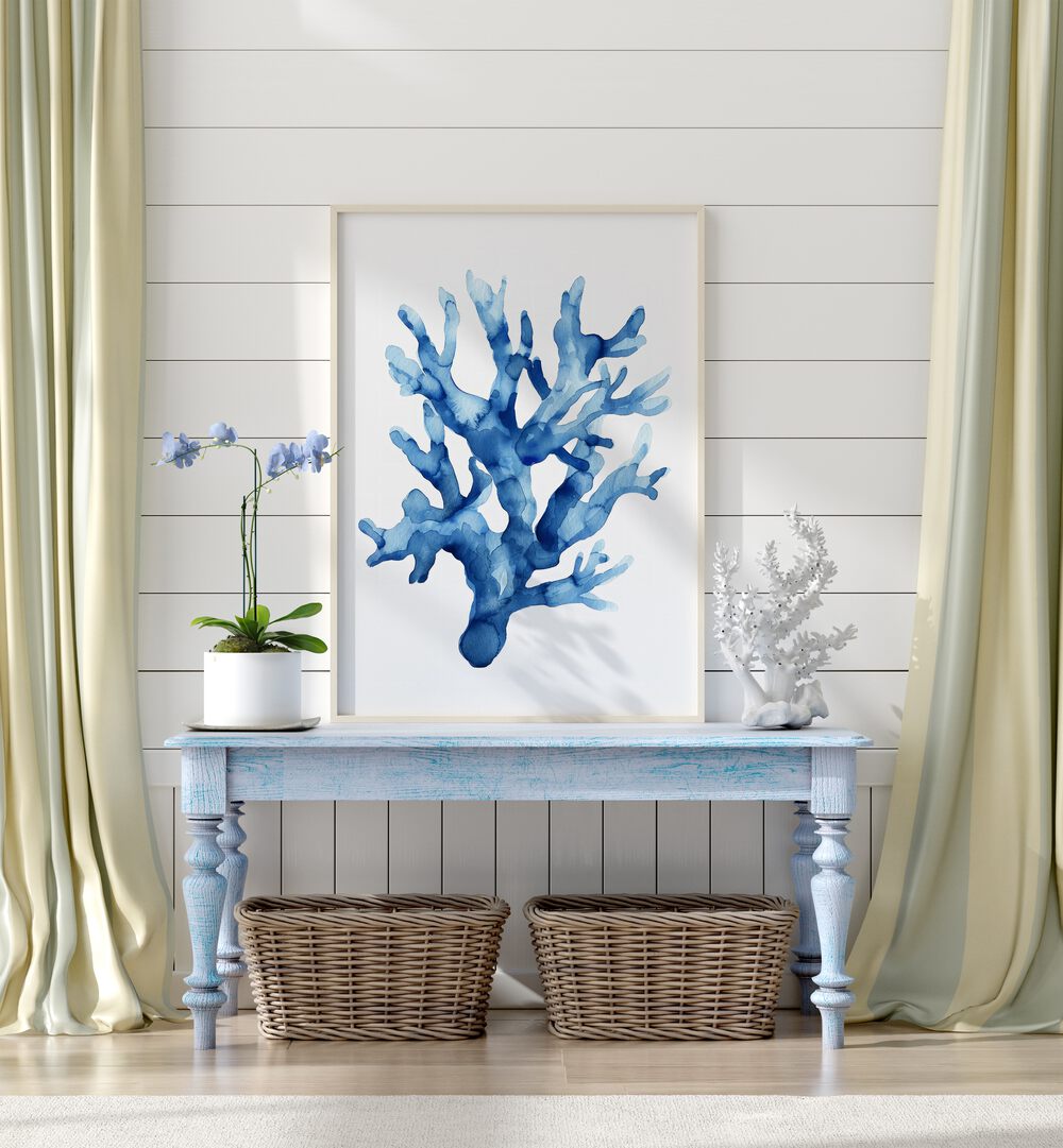 Marine Botanicals II Beach Prints Coastal Wall Art in White Plain Frame placed on a blue table beside a plant and a show piece