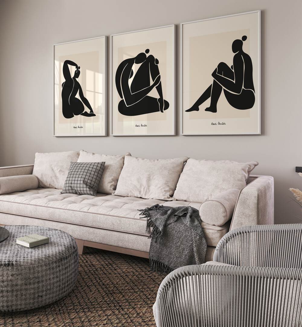 Matisse Set Set Of 3 Paintings in White Plain Frame placed on a wall living room wall behind a sofa