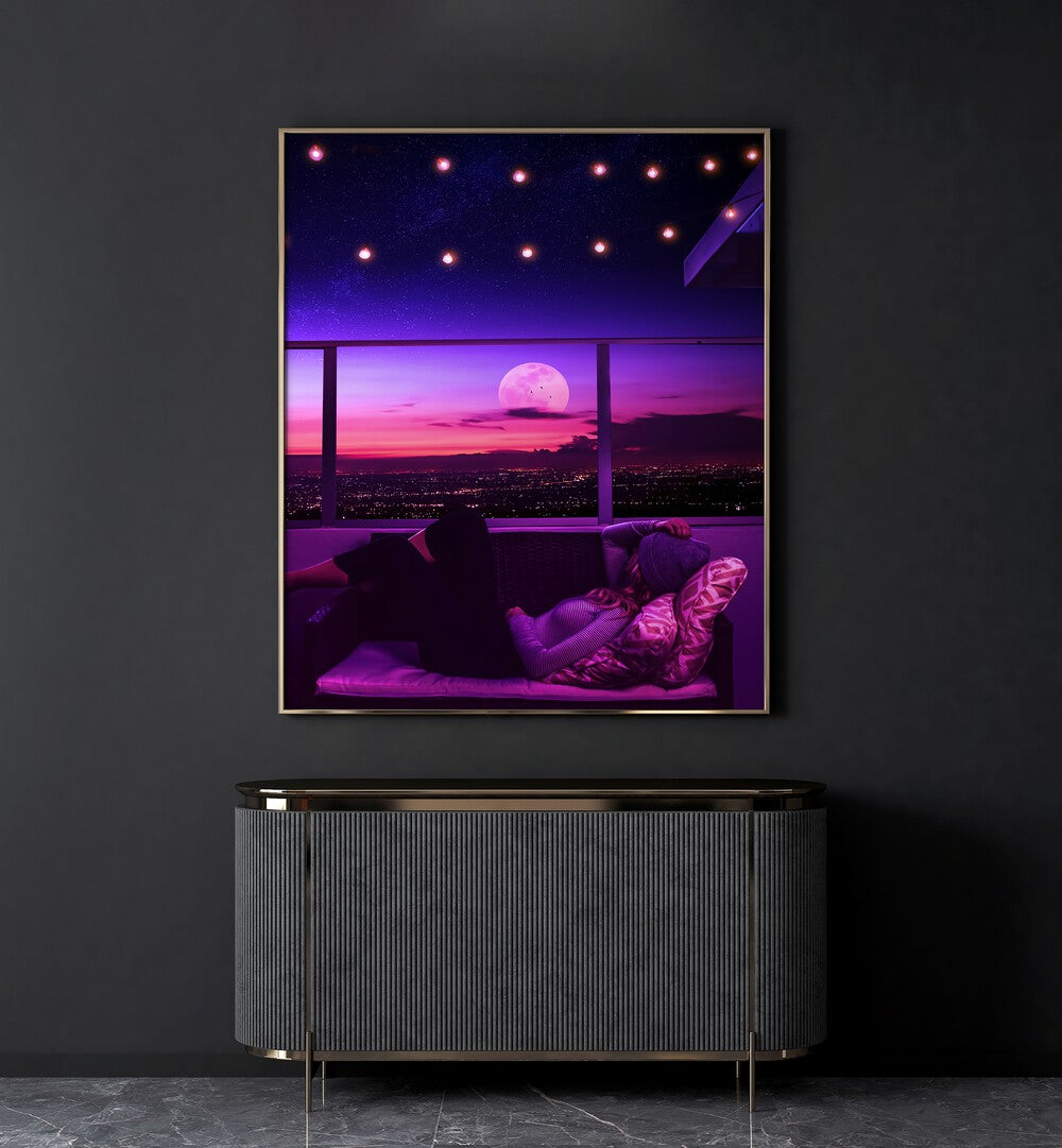 Mellow Out By Ritvik Takkar Surreal Art Prints in Gold Plain Frame placed on a Dark Grey Colored Wall above a Console Table in the Drawing Room