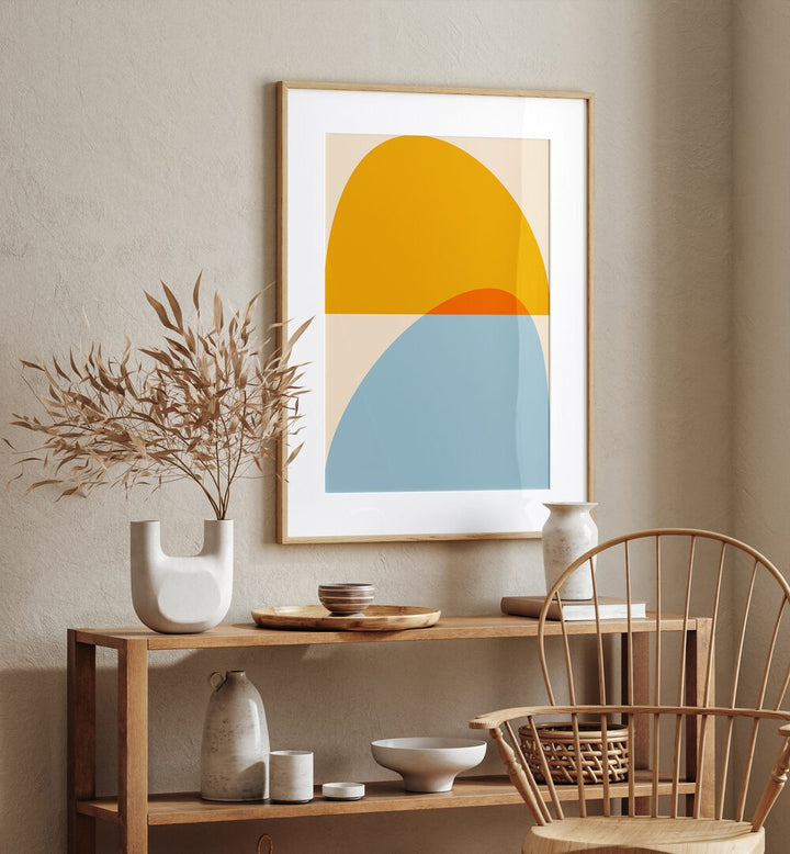 Mid Century Pastel Xviii By Ana Rut Bre Abstract Art Abstract Wall Art in Oak Wood Frame With Mount placed on a wall behind a table