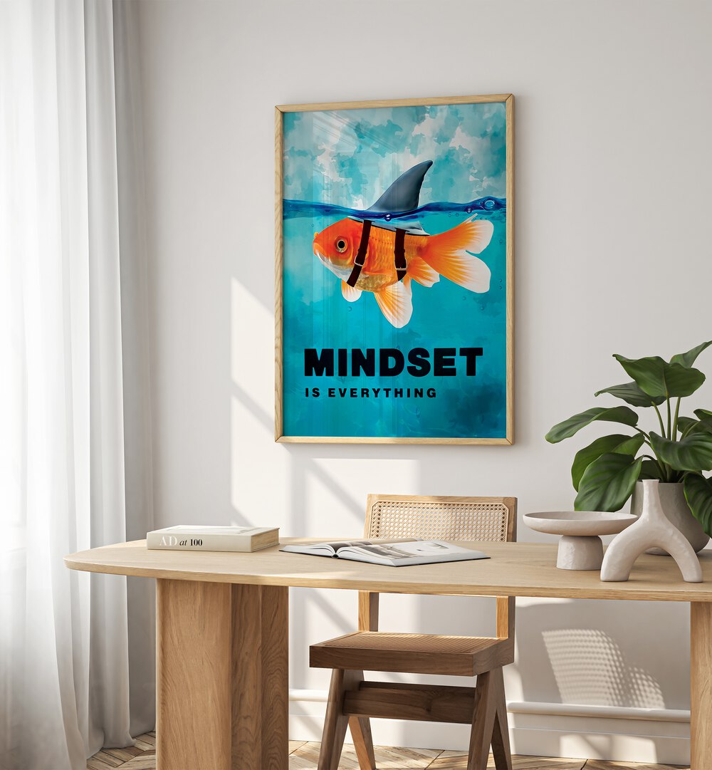 Mindset Is Everything Quotes And Typography Posters in Oak Wood Plain Frame placed on a White  Colored Wall near a Study Table in a Workspace in the Drawing Room