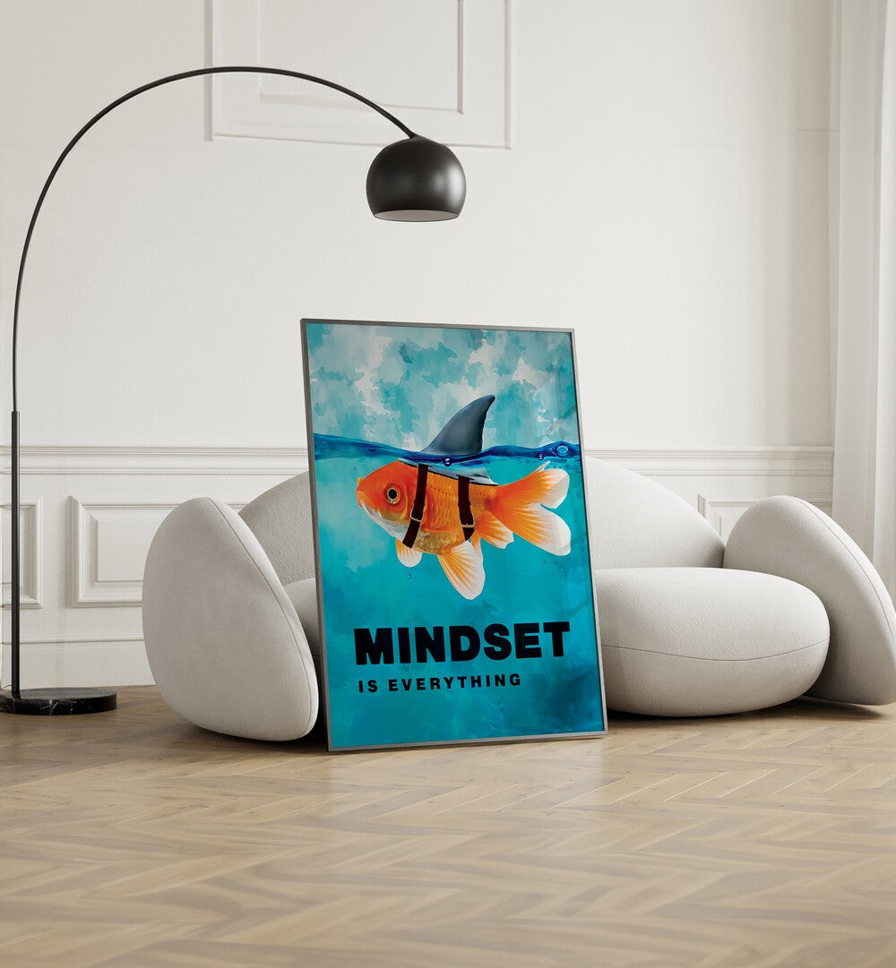 Mindset Is Everything Quotes And Typography Posters in Black Plain Frame placed on the floor near a White Sofa in the Living Room