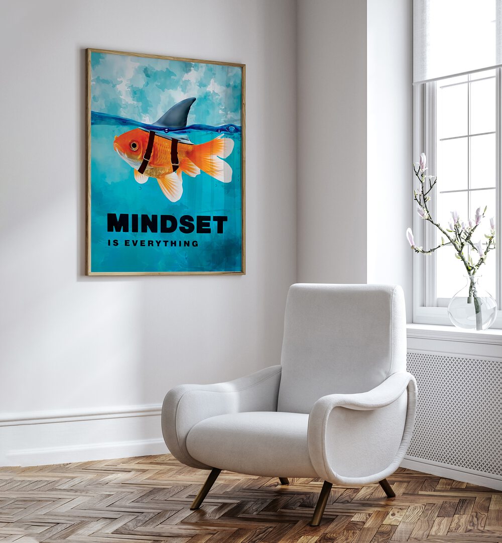 Mindset Is Everything Quotes And Typography Posters in Oak Wood Plain Frame placed on a White Colored Wall near a White Sofa Chair in the Drawing Room