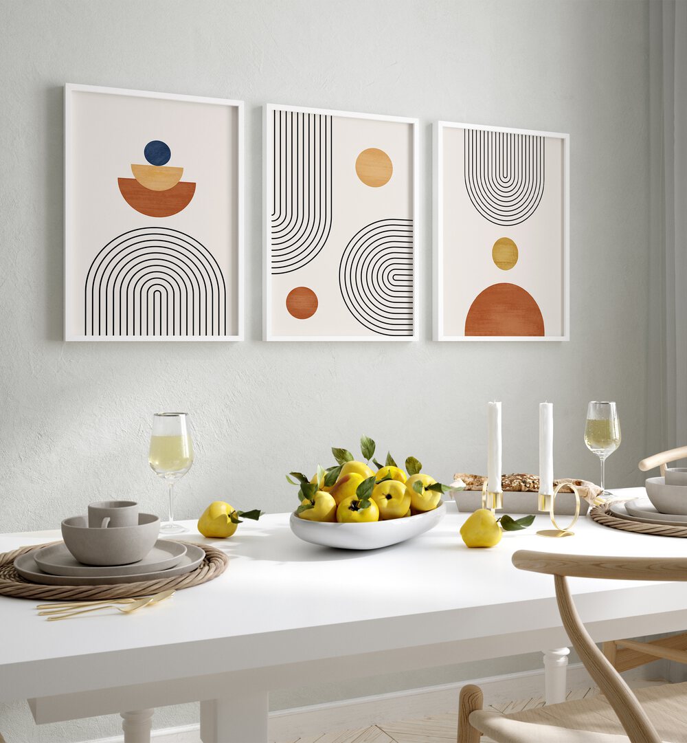 Minimalism Boho Arts Set Of 3 Paintings in White Plain Frame placed on a wall behind a dining table a for dining area