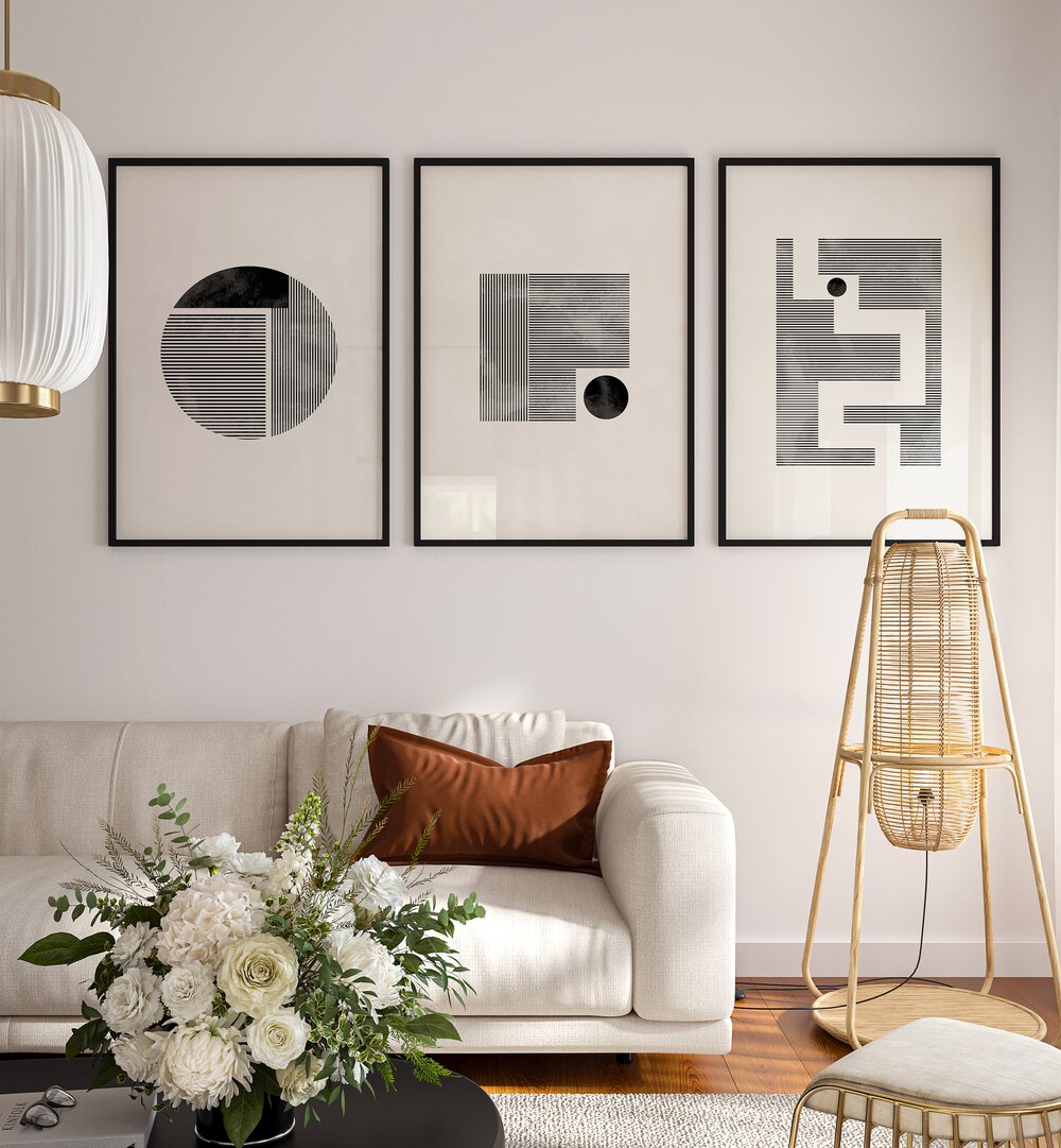 Minimalist Maze Set Set Of 3 Paintings in Black Plain Frame placed on a living room wall behind a white sofa