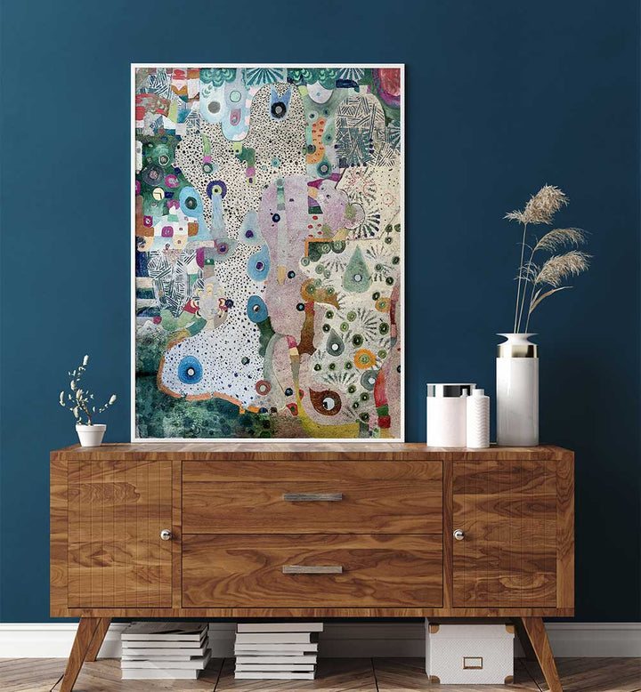 Framed MIRRORS AND SPACE , ABSTRACT PAINTINGS above walnut console against teal wall with vases and dried grasses