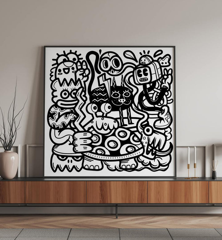 Mischievous Creatures Doodle Art Painting in Black Plain Frame placed on a black table