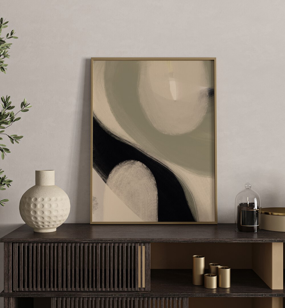 Modern Abstract I by Yopie Studio Abstract Paintings Abstract Art Prints in Oak Wood Plain Frame placed on a table beside a plant