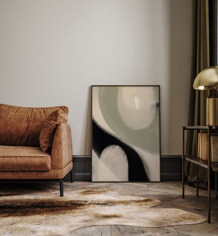 Modern Abstract I by Yopie Studio Abstract Paintings Abstract Art Prints in Black Plain Frame placed on the floor beside a sofa