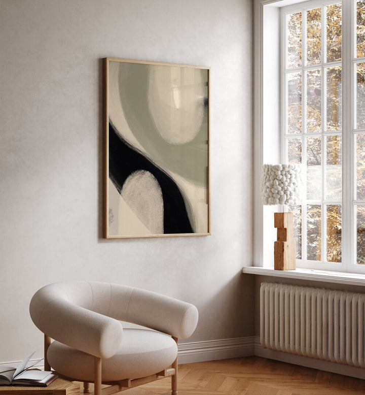 Modern Abstract I by Yopie Studio Abstract Paintings Abstract Art Prints in Oak Wood Plain Frame placed on a wall beside a window and behind a chair