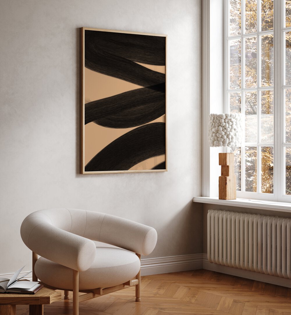 Modern Abstract ii by Yopie Studio Abstract Paintings Abstract Art Prints in Oak Wood Plain Frame placed on a wall beside a window and behind a chair