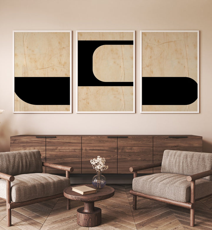 Modern Geometric Set Set Of 3 Paintings in White Plain Frame placed on a wall behind a brown console table 